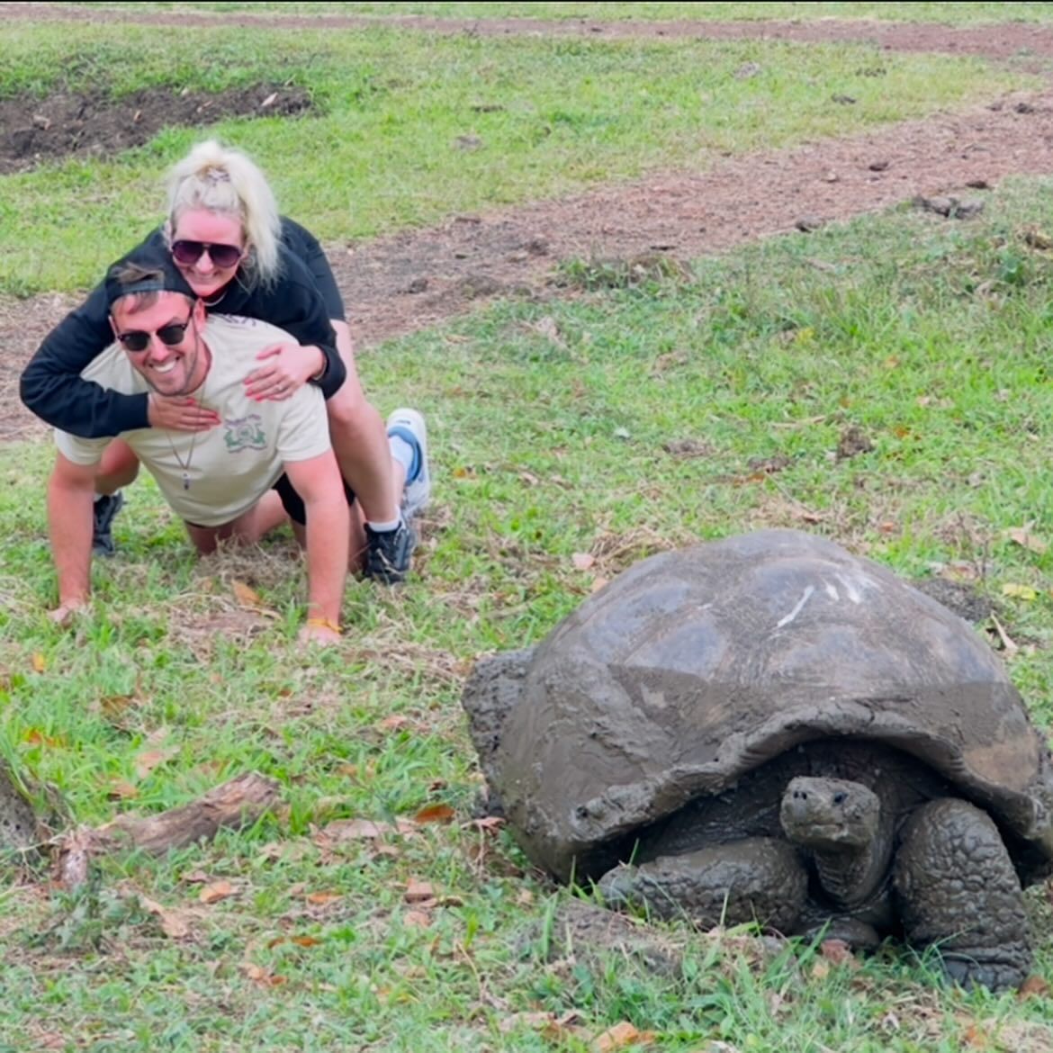 With a giant tortoise, photographed by Si and Beth