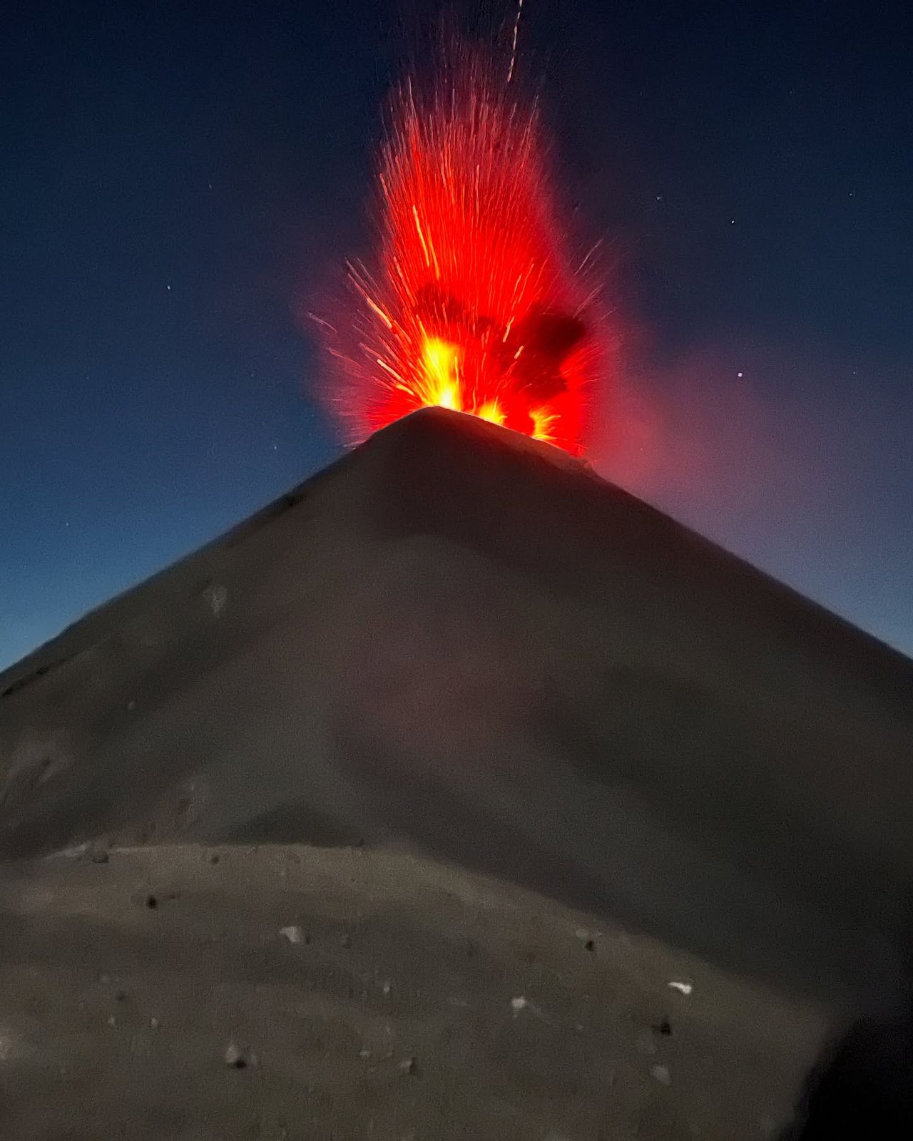 Fuego erupting at night, seen from the Acatenango trail, photographed by Si and Beth