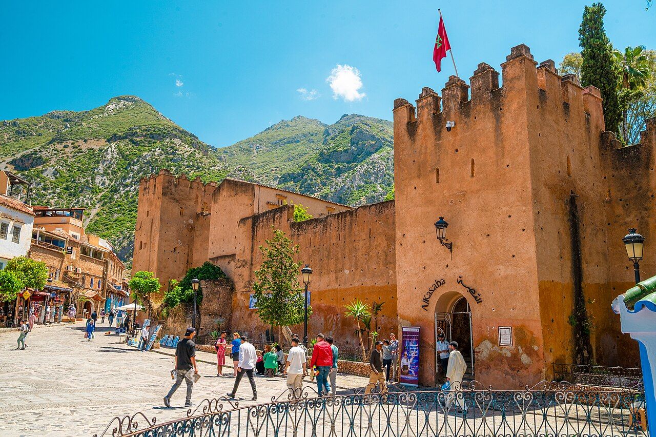 Kasbah de Chefchaouen in Chefchaouen during midday, from place Outa El-Hammam, with the rif mountains view behind it and