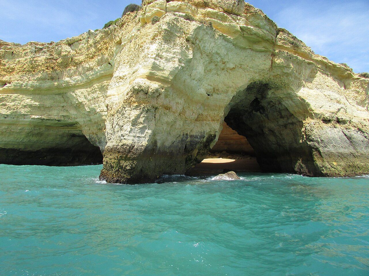 Aboard the "Dreamwave" boat trip looking at the entrance to the Algar de Benagil sea cave east of Praia de Benagil, Alga