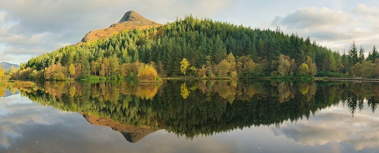 Water reflections in Glencoe Lochan, with the Pap of Glencoe overlooking the scene. This is a panorama in cylindrical pr