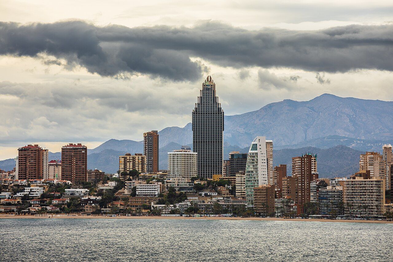 Distant skyline behind Platja de Ponent beach as seen from Plaça del Castell in Benidorm, Alicante, Spain in 2024 Januar
