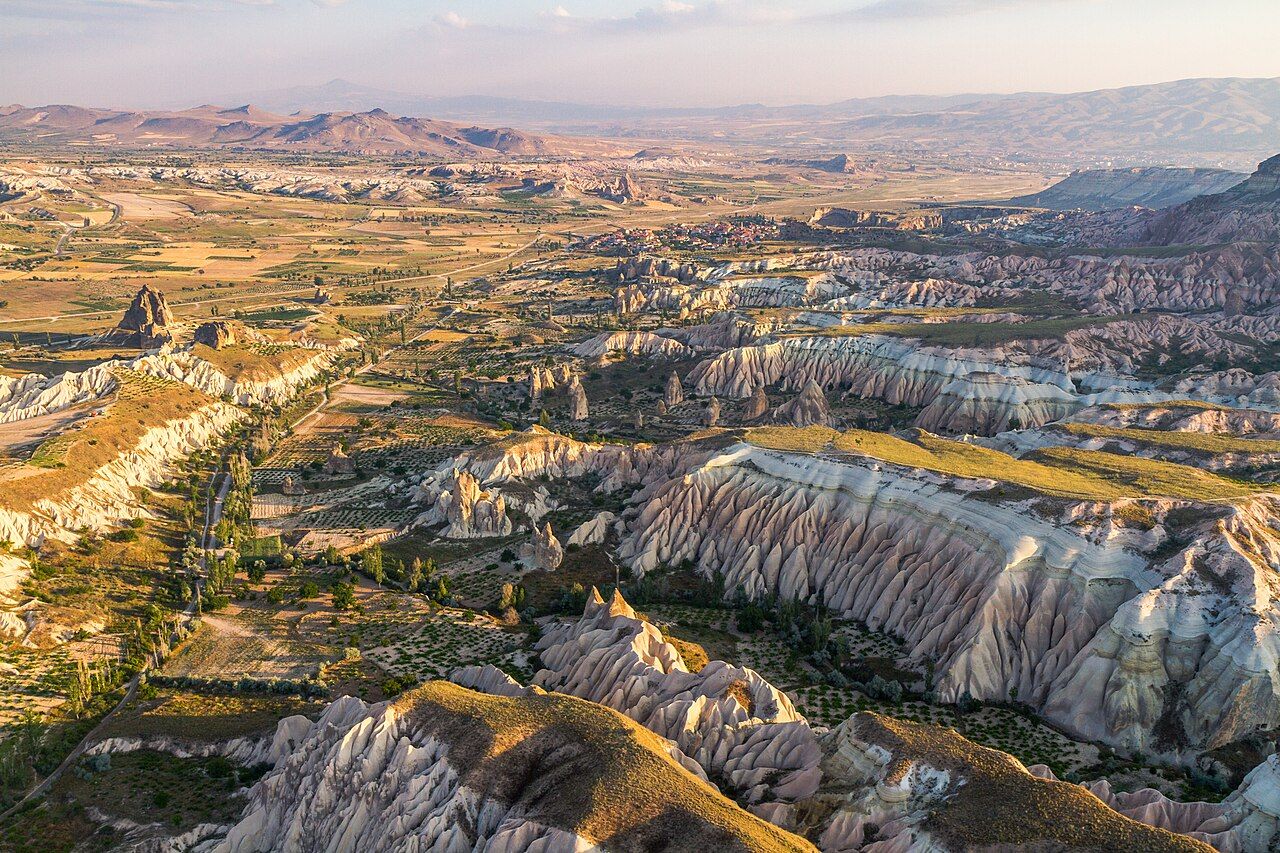 Aerial view over Cappadocia, nearby Gorëme, Turkey. Features from very far top to bottom, the city of Avanos, its small 