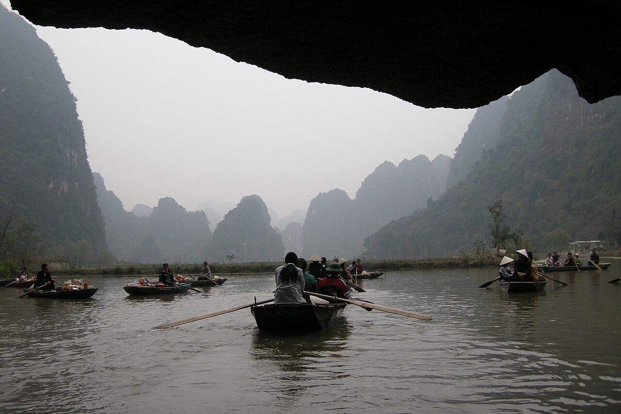 Tràng An scenic area near Ninh Binh, Vietnam with limestone mountains, rivers and wetlands. A UNESCO World Heritage Site